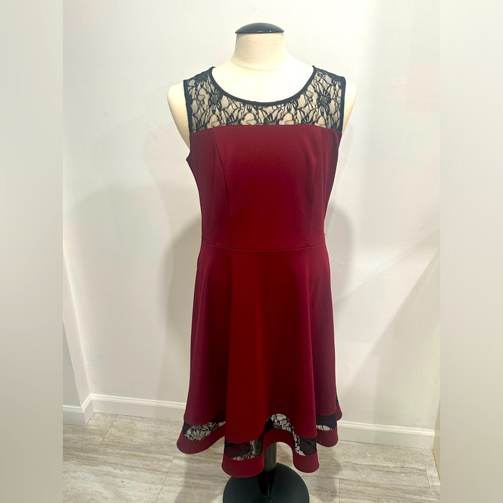 Sleeveless wine colored dress with black lace detail.